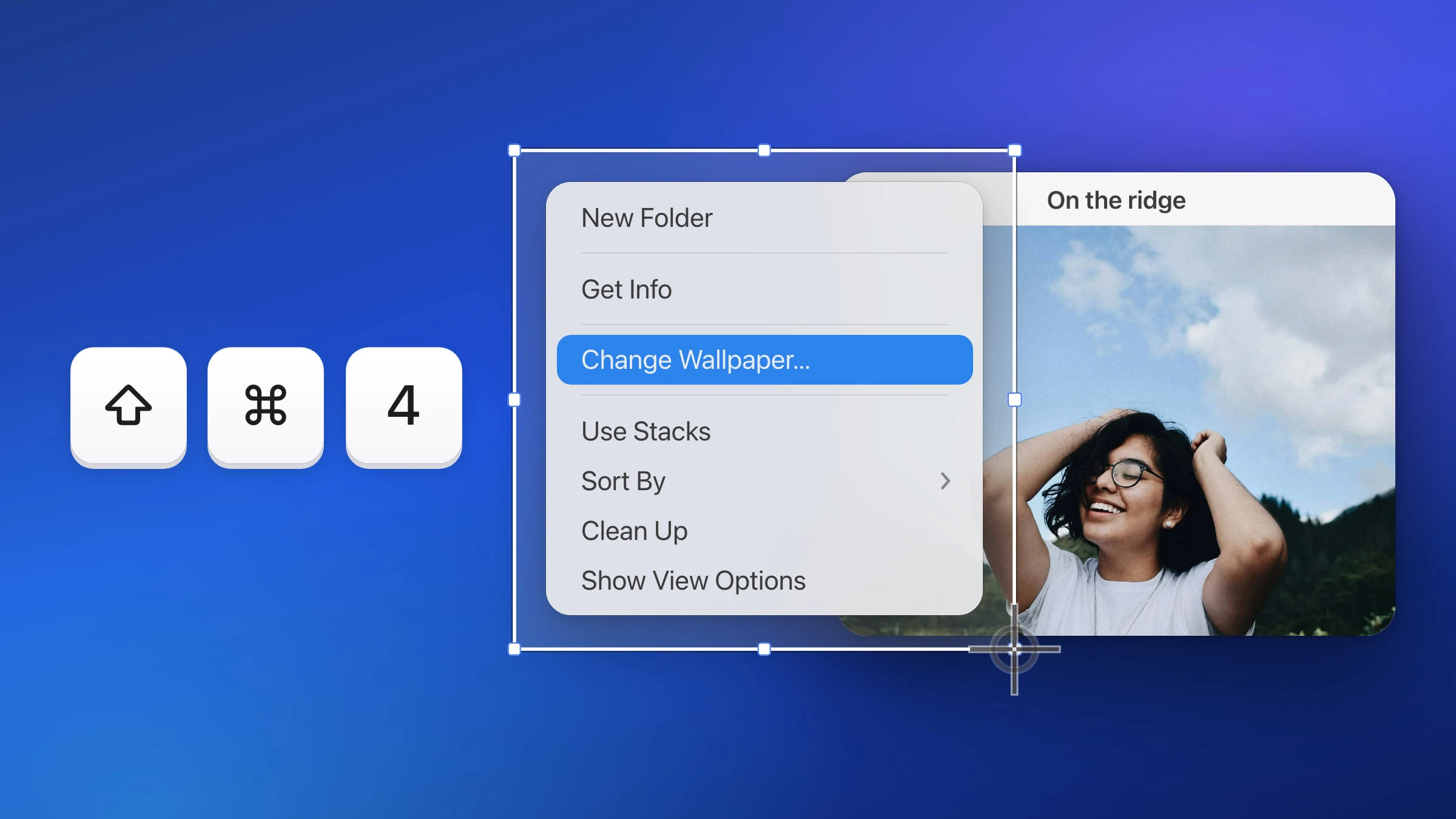 The Finder right-click menu open on a blue Mac desktop over a photo window, with Change Wallpaper… highlighted, framed by a Snapix area selection with the crosshair at its corner, beside the keys Shift, Command and 4