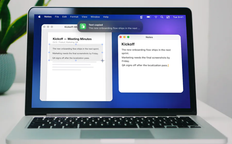 Snapix Extract Text on a MacBook Pro: the selection over three lines of a meeting-minutes PDF, a Text copied banner at the top of the screen, and the same lines pasted into Notes