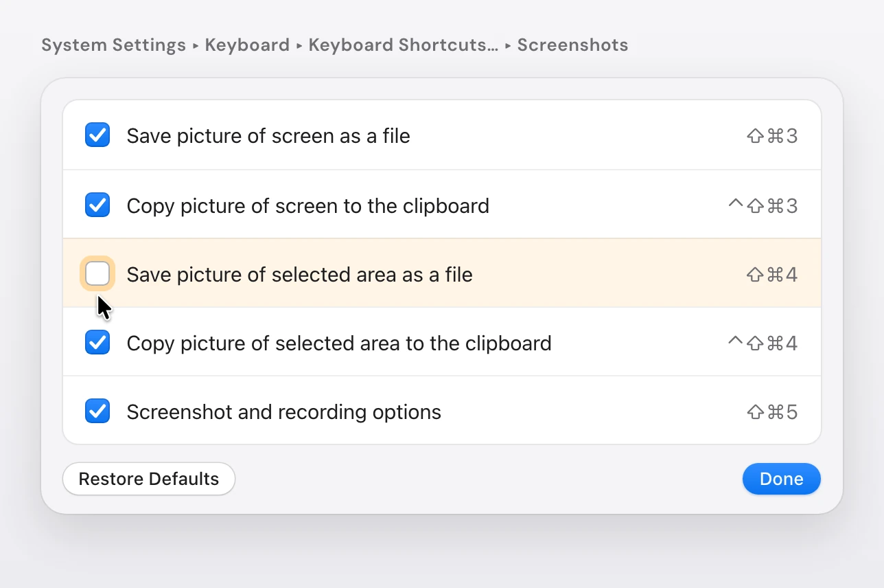 The Screenshots list in System Settings, Keyboard, Keyboard Shortcuts: Save picture of screen as a file Shift-Command-3, Copy picture of screen to the clipboard Control-Shift-Command-3, Save picture of selected area as a file Shift-Command-4 with its box unticked and the pointer on it, Copy picture of selected area to the clipboard Control-Shift-Command-4, and Screenshot and recording options Shift-Command-5, above the Restore Defaults and Done buttons